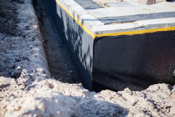 Professional Waterproofing technician working in Marne, MI